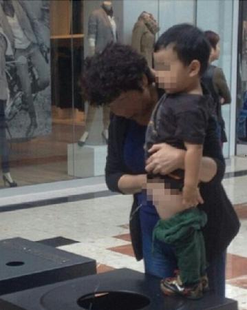 Boy peeing in B.C. mall trash bin photo sparks online debate